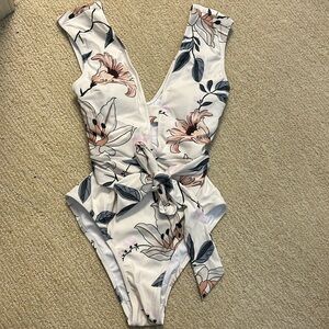 Size small one piece swim suit. Never worn. Tags removed.